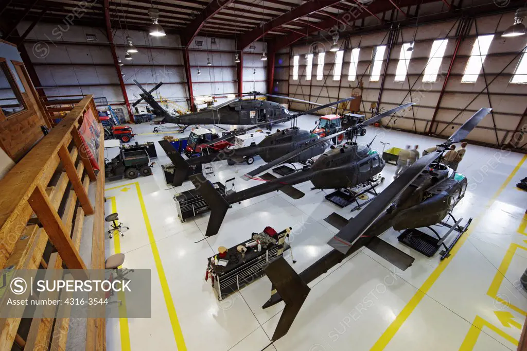 Hangar at HAATS, or High Altitude Army National Guard Training Site, a base where military pilots learn about high density altitude flying, with OH-58 Kiowa Helicopters and a UH-60 Blackhawk.