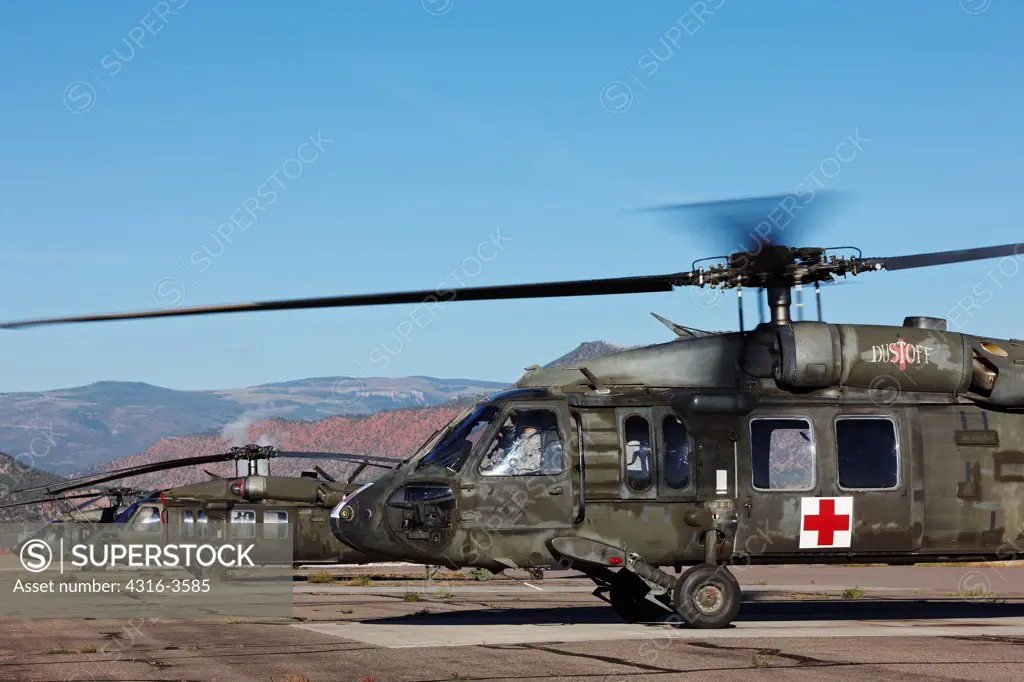 A Sikorsky UH-60 Blackhawk helicopter, in a Medevac configuration, prepares to launch at the High Altitude Army National Guard Training Site in the Rocky Mountains of Colorado.