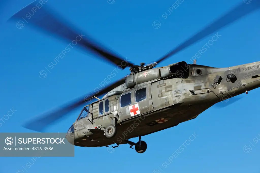A Sikorsky UH-60 Blackhawk helicopter, in a Medevac configuration, launches at the High Altitude Army National Guard Training Site, Rocky Mountains of Colorado.
