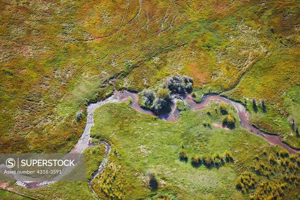 Aerial view of a creek and meadow in the Rocky Mountains of Colorado