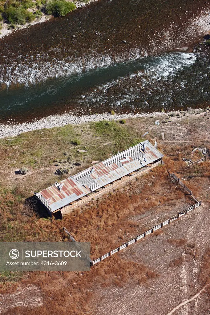 Aerial view of a livestock corral and the Eagle River, in the Rocky Mountains of Colorado.