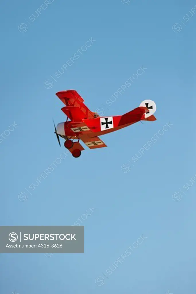 Radio controlled scale model Fokker DR.1 Dreidecker Triplane during a demonstration flight of scale model combat aircraft.
