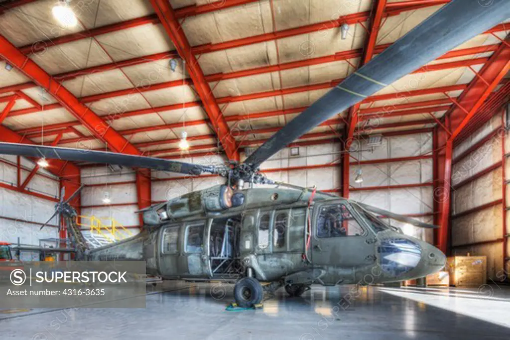 Hangar at HAATS, or High Altitude Army National Guard Training Site, a base where military pilots learn about high density altitude flying, with a Sikorsky UH-60 Blackhawk helicopter. High Dynamic Range, or HDR image.