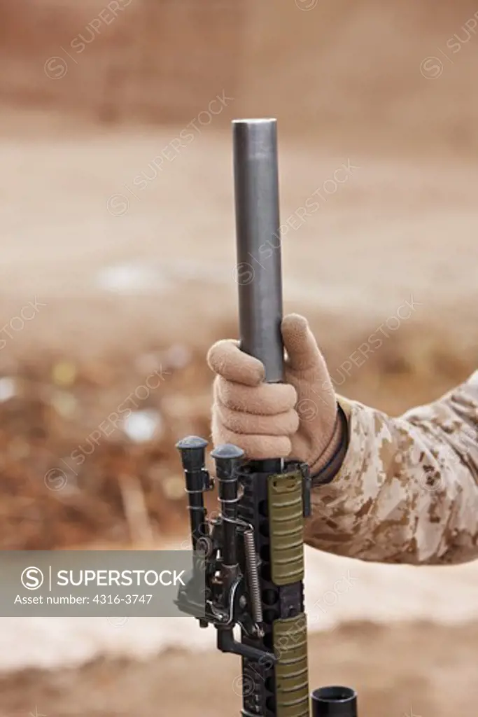 Detail of Suppressor On A U.S. Marine Corps Rifle.