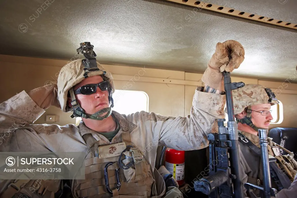 U.S. Marine Inside an MRAP, or Mine Resistant Ambush Protected Vehicle in Afghanistan's Helmand Province.