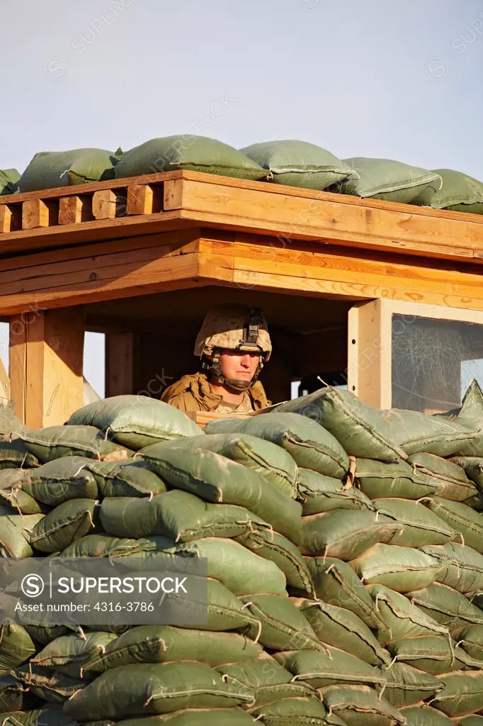 A U.S. Marine in a Guard Tower at a Small, Remote, Austere U.S. Marine Corps Combat Outpost in Afghanistan's Helmand Province