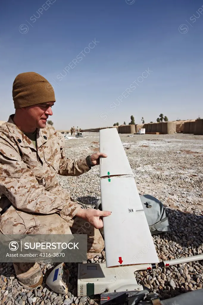 A U.S. Marine Assembles an Unmanned Aerial Vehicle (UAV) in Afghanistan's Helmand Province