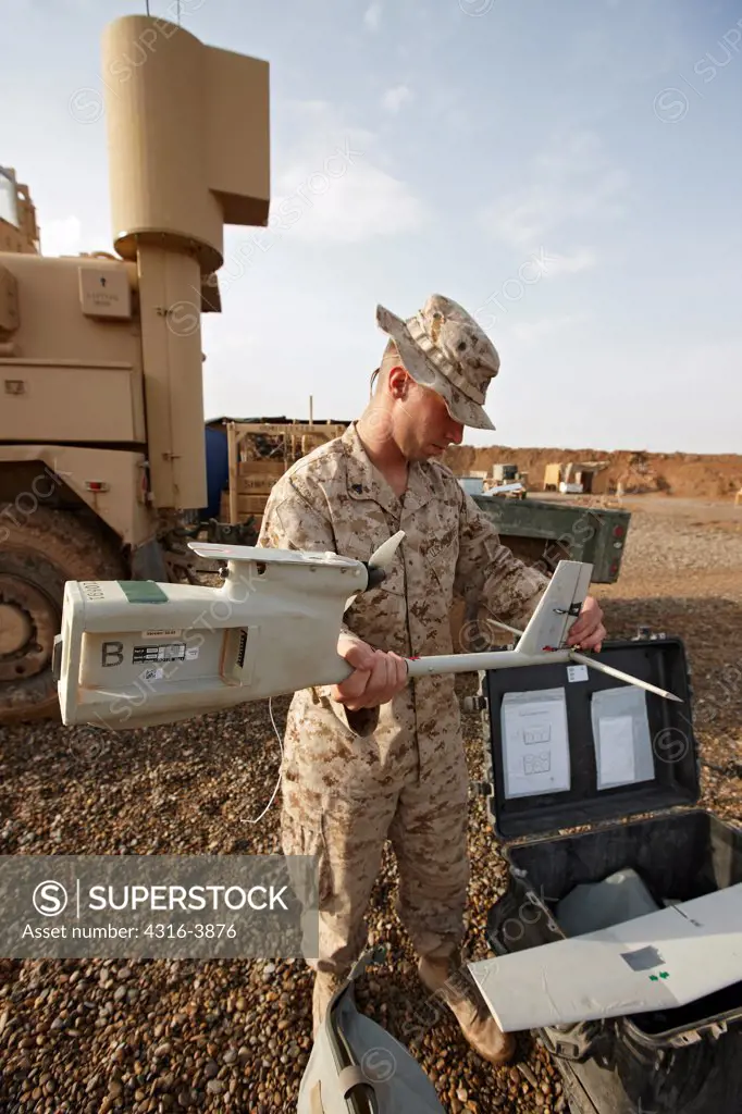 A U.S. Marine Assembles an Unmanned Aerial Vehicle (UAV) in Afghanistan's Helmand Province