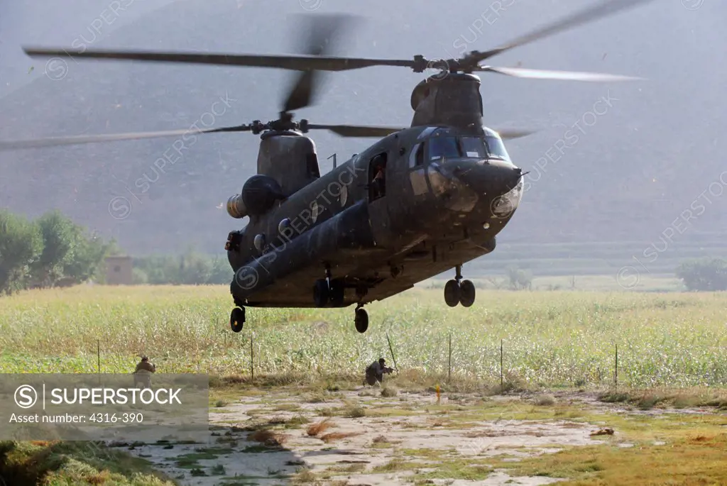 A CH-47 Chinook Heavy Lift Helicopter Lands at a Dirt Landing Zone at Nangalam, Afghanistan