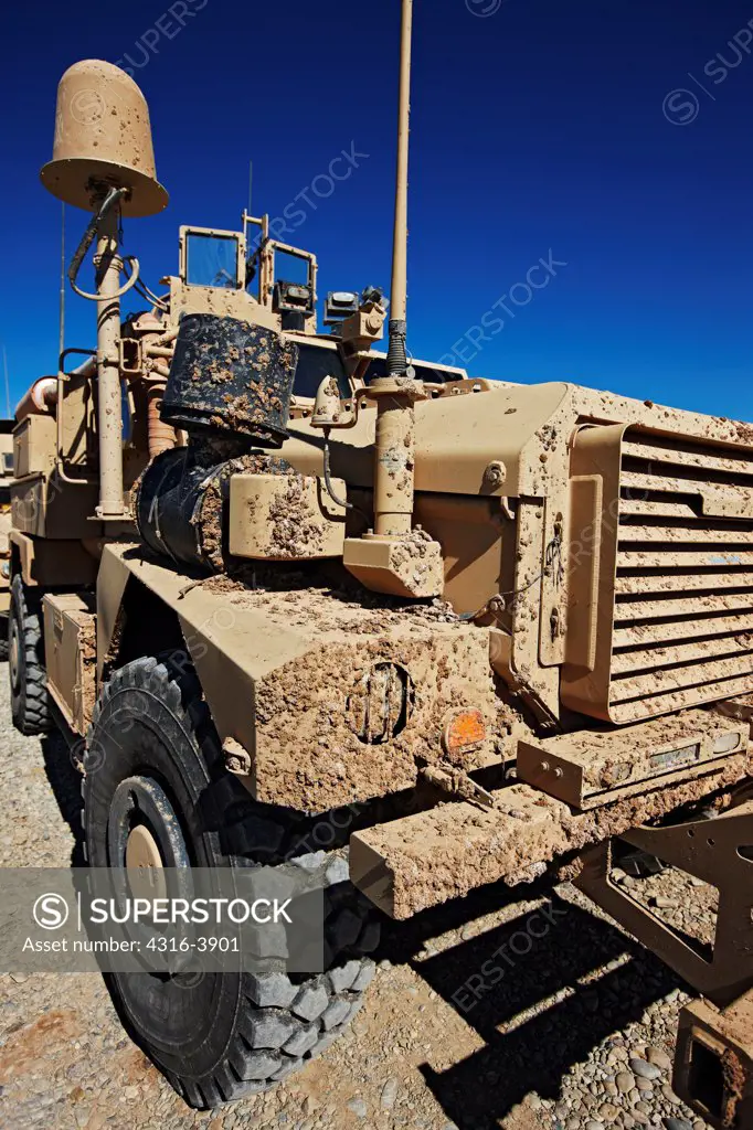Mud Covered MRAP, or Mine Resistant Ambush Protected Vehicle at a U.S. Marine Corps Forward Operating Base in Afghanistan's Helmand Province