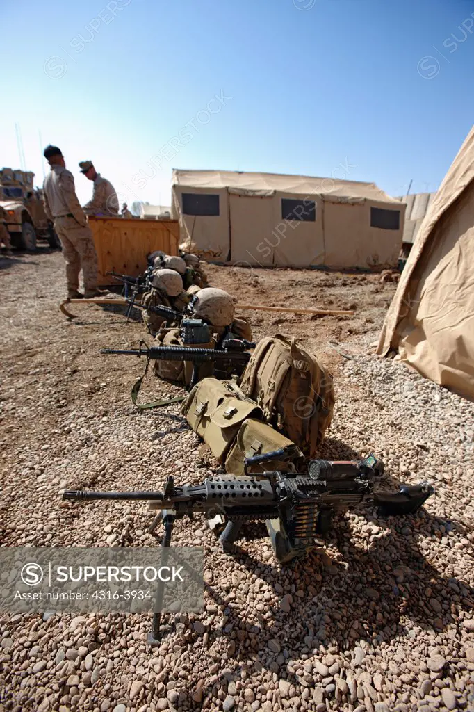 U.S. Marine Corps Weapons, including an M249 Squad Automatic Weapon, or SAW, and an M16, Lined up Before a Combat Operation in Afghanistan's Helmand Province