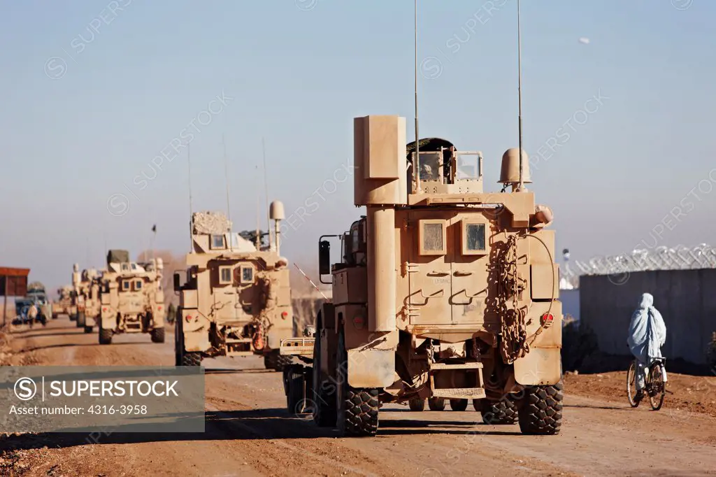 Convoy of U.S. Marine Corps MRAPs, or Mine Resistant Ambush Protected Vehicles, Town of Marjah, Helmand Province, Afghanistan