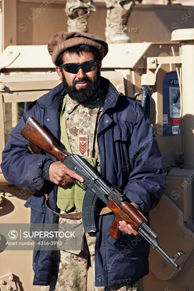 Afghan National Army Soldier Holding an AK47 at a Combat Outpost in Afghanistan's Helmand Province