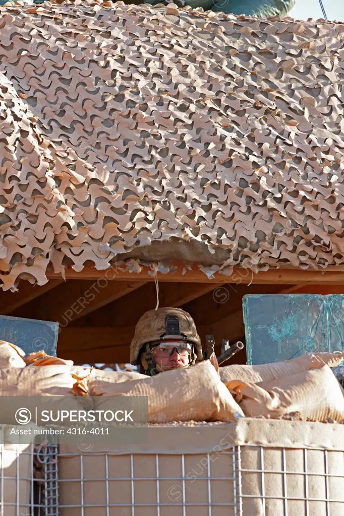A U.S. Marine in a Guard Tower at a Small, Remote, Austere U.S. Marine Corps Combat Outpost in Afghanistan's Helmand Province