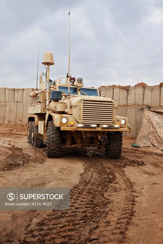 A U.S. Marine Corps MRAP, or Mine Resistant Ambush Protected Vehicle at a Small Combat Outpost in Afghanistan's Helmand Province