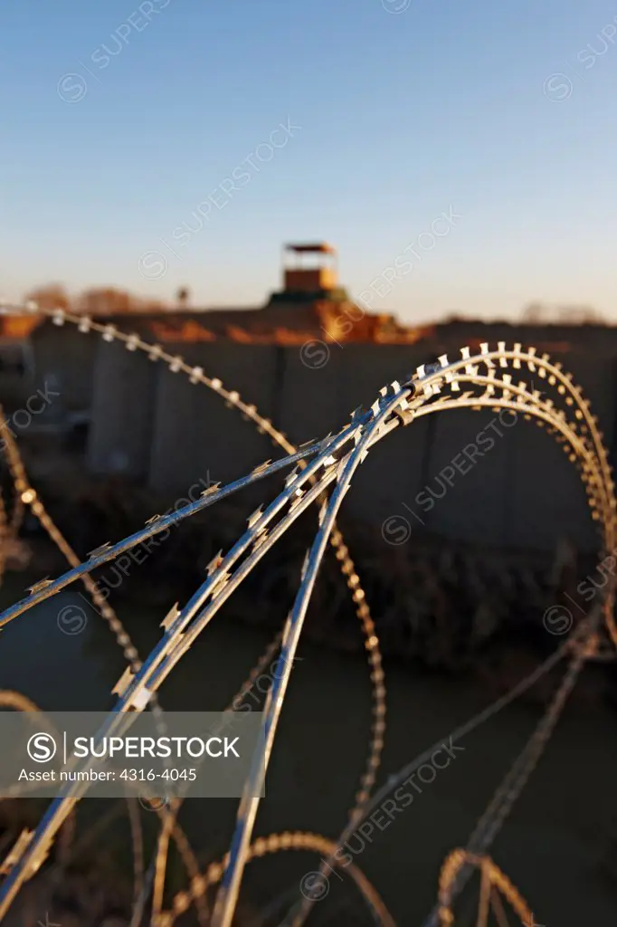Concertina Razor Wire and Distant Guard Tower, Combat Outpost in Afghanistan's Helmand Province