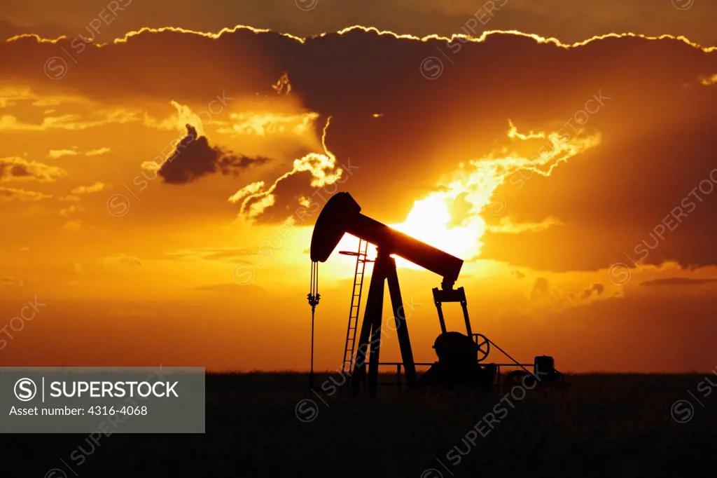 Oil Well Pump Jack at Sunset