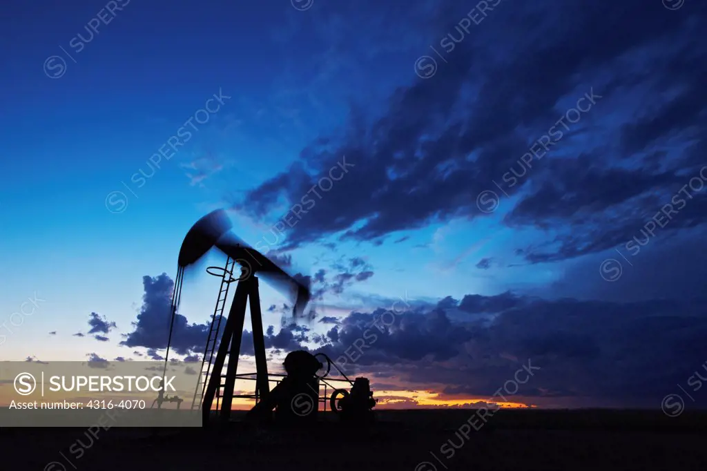 Oil Well Pump Jack at Dusk, Blurred Motion
