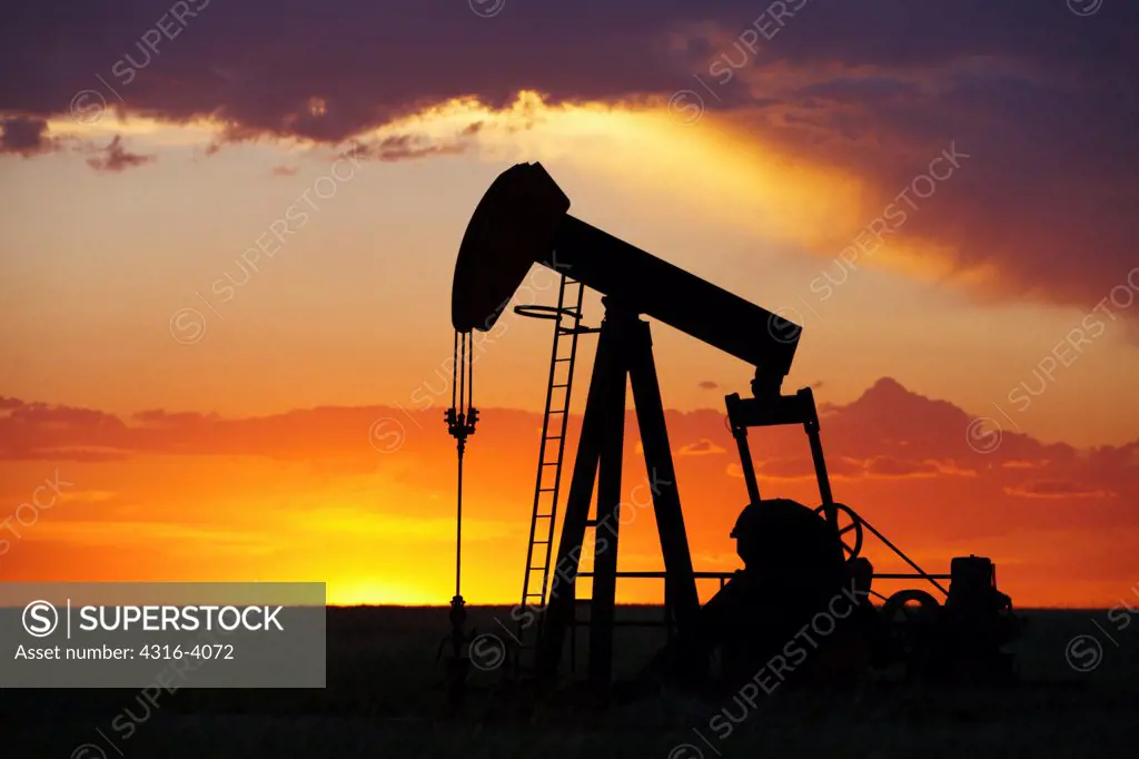 Oil Well Pump Jack at Sunset