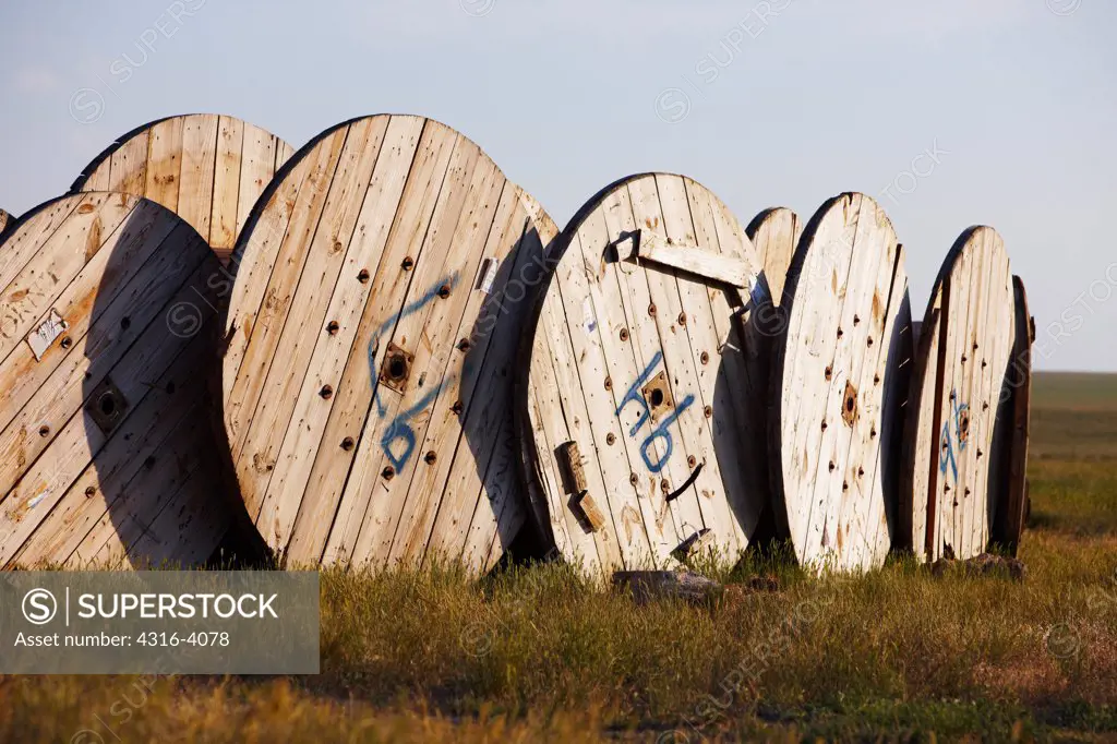 Large Cable Spools Arranged to Make Fenced Enclosure