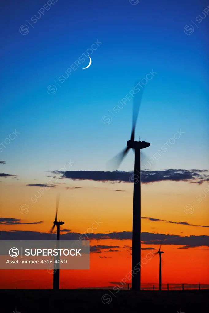 Silhouettes of Wind Turbines at Dusk, Crescent Moon