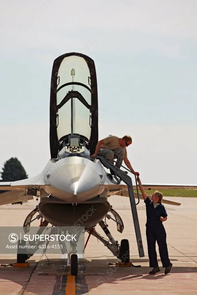 Technicians Perform Pre-Flight Preparations to an F-16