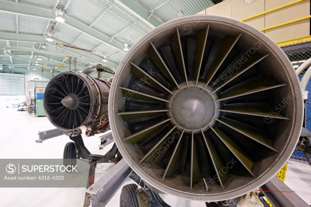 Two Jet Engines, Each Showing Turbine Blades, Side-by-Side
