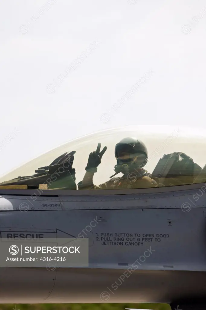 Pilot Makes a Peace Gesture Before Launching F-16
