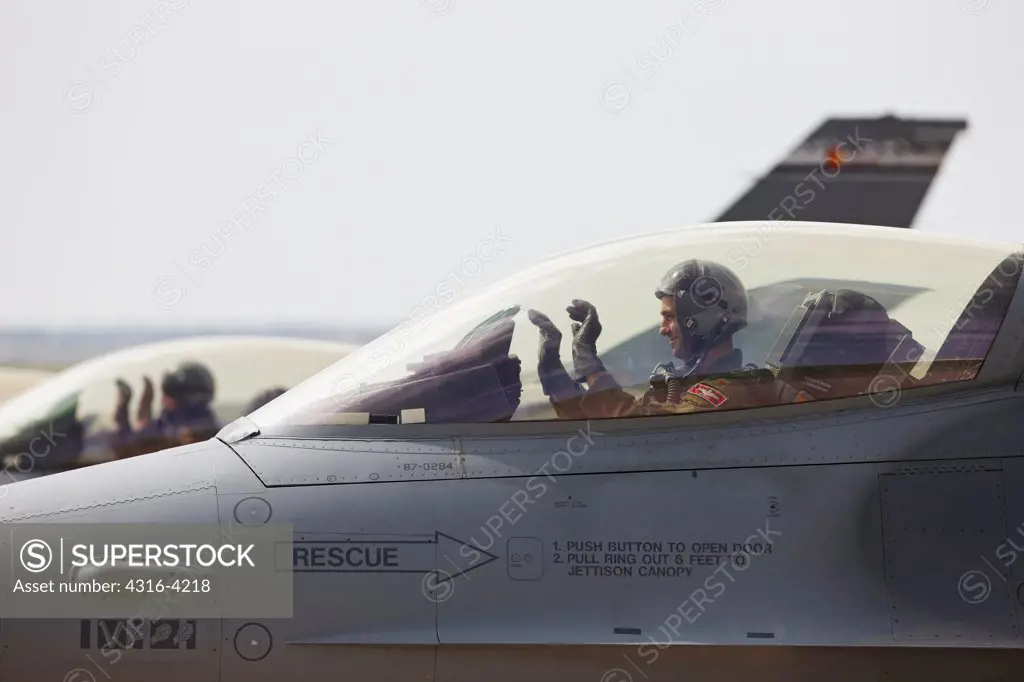 F-16 Pilots Show Hands During Arming Phase of Launch of F-16s