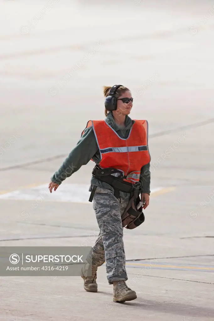 Ground Crew Member on Flight Line During Launch of F-16s