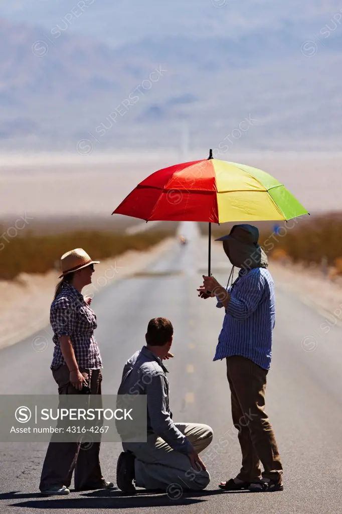 Documentary Production Crew in Middle of Desert Highway