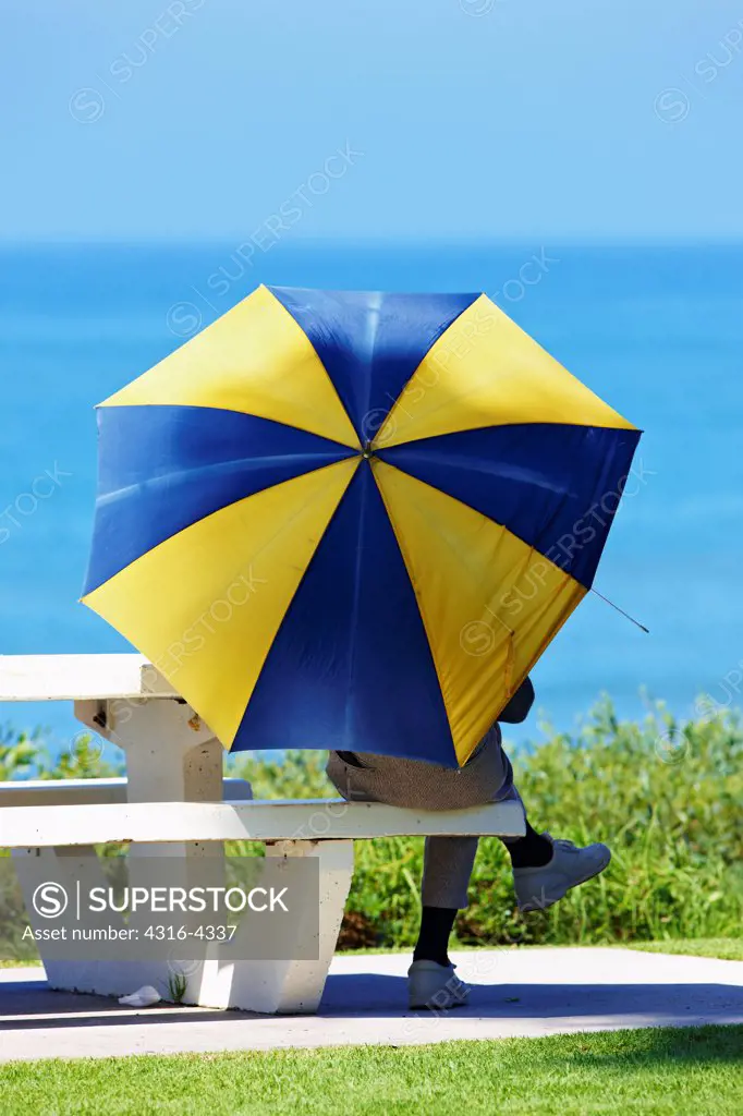 Man Under Sun Umbrella