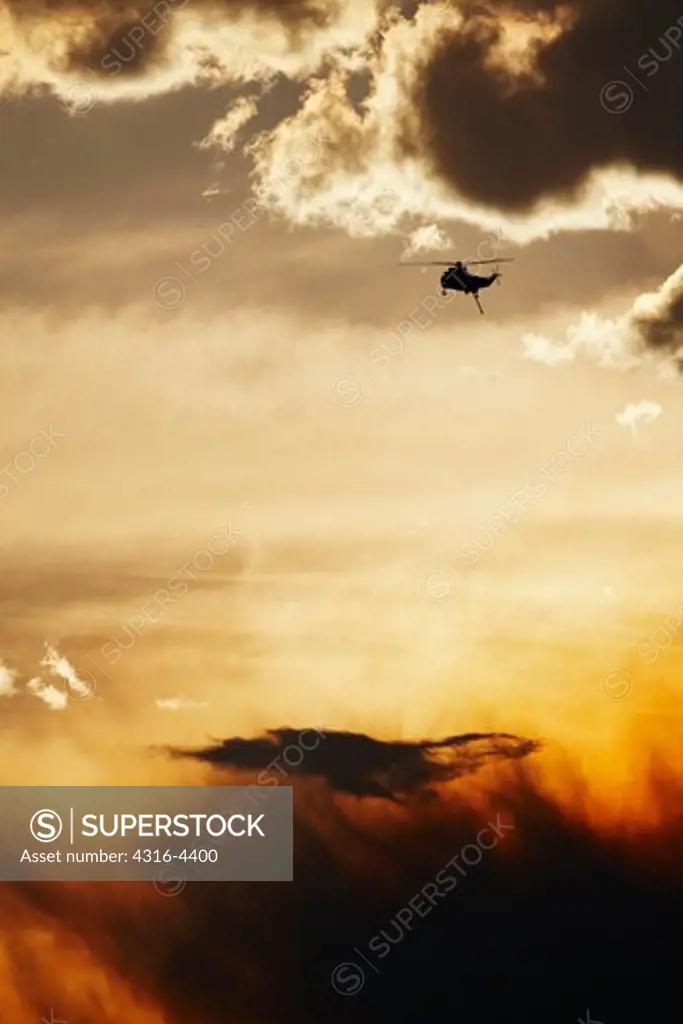 Helicopter Flying Through Smoke of Wildfire