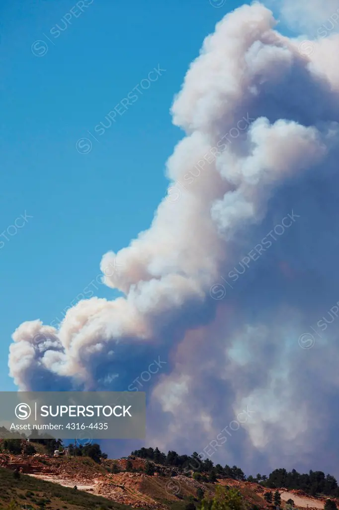 Raging mountain wildfire, rising smoke, northern Colorado, USA
