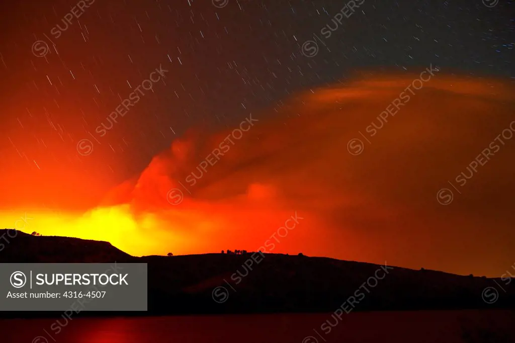 Night view of raging mountain wildfire, Colorado, USA