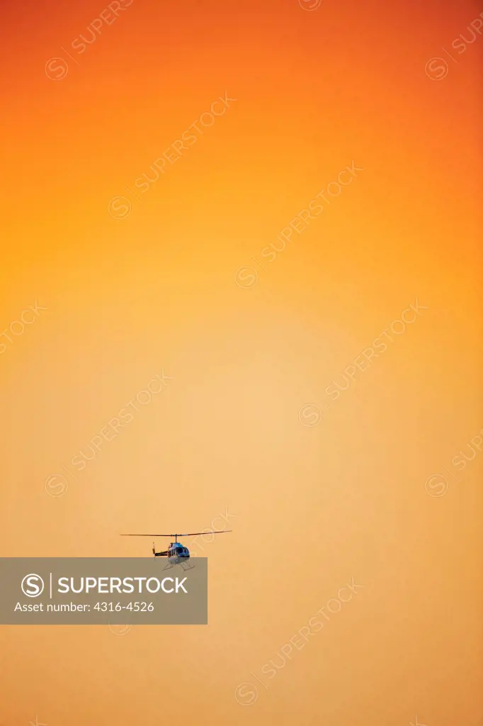 Helicopter flies through dense smoke from raging mountain wildfire, Colorado, USA