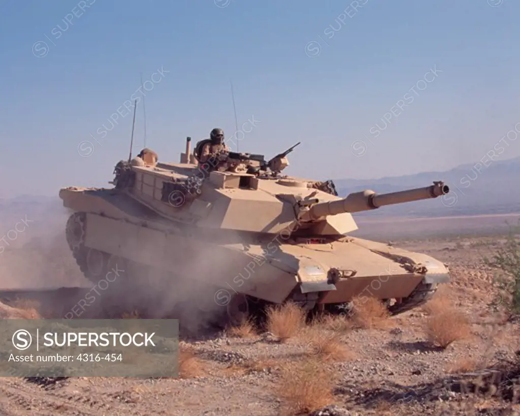 A US Marine Corps M1A1 Abrams Battle Tank Roars Through the Desert