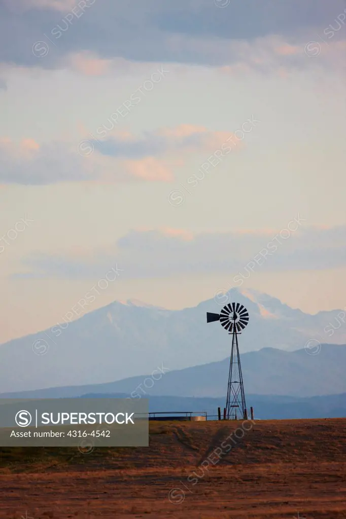 Lone Windmill, distant Longs Peak (14,259 feet, 4,346 meters), Colorado, USA
