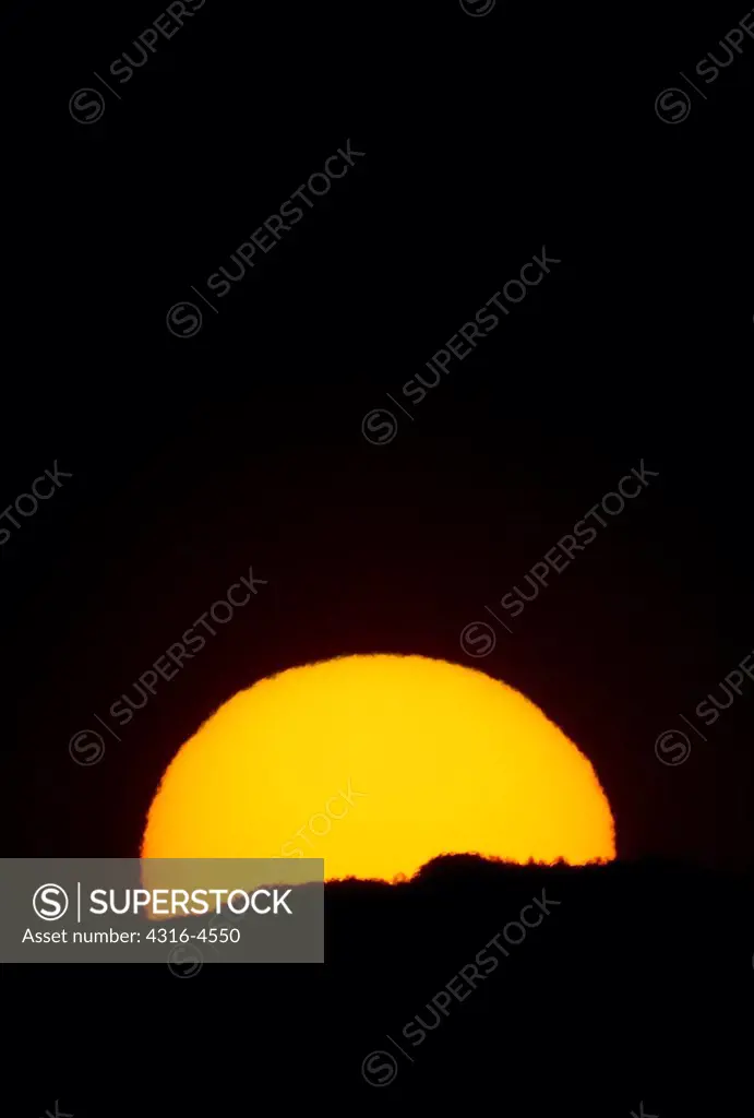 Telephoto view of the setting sun