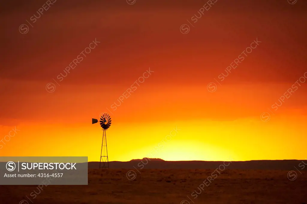 Sunset light and lone windmill, Colorado, USA