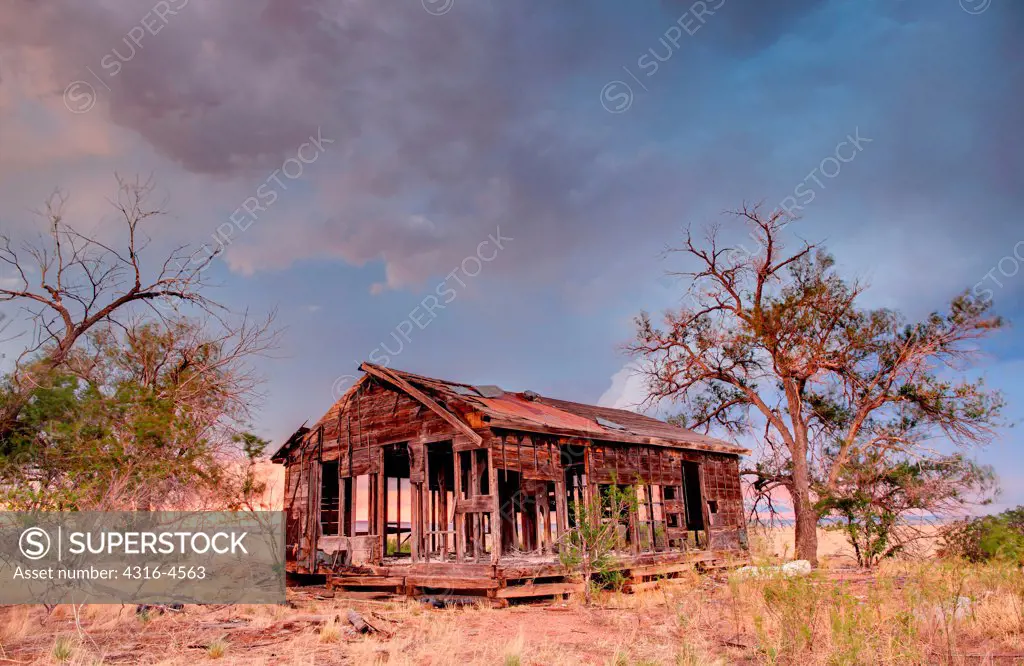 Abandoned ranch house,  passing thunderstorm, Colorado, USA