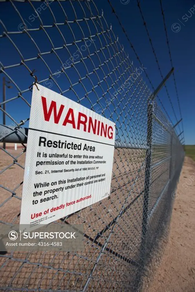 Warning sign that deadly force is authorized to be used on trespassers at a Minuteman III nuclear missile silo, Colorado