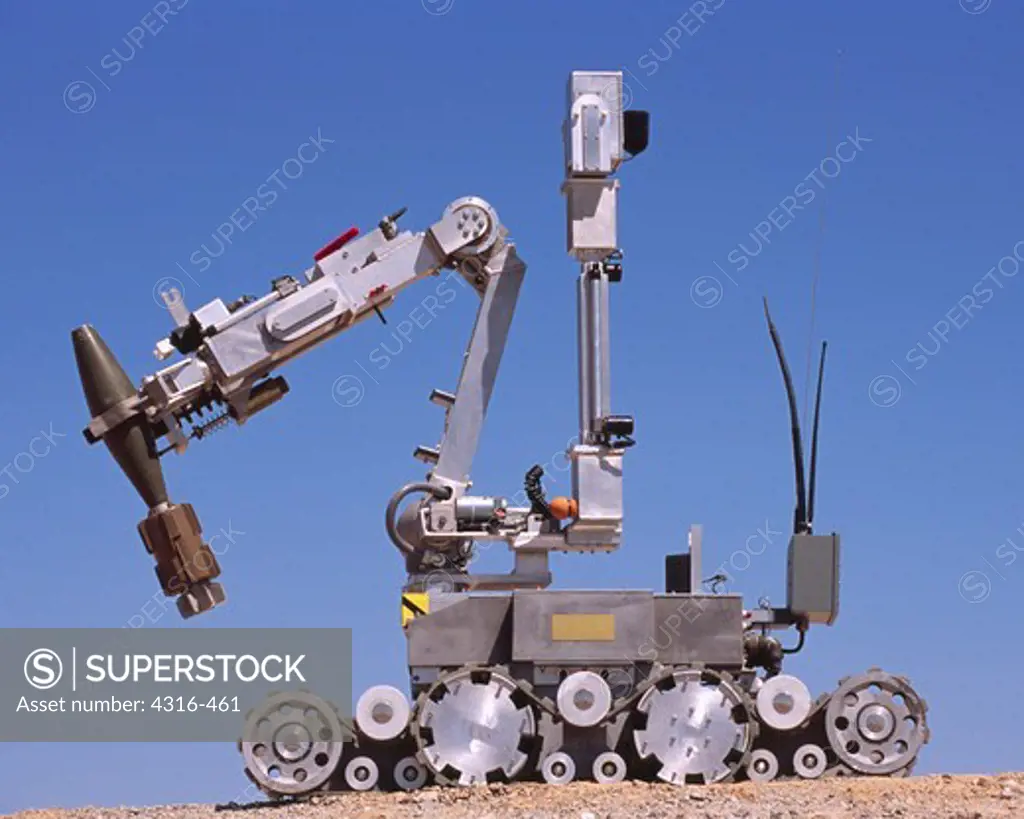 An Explosive Ordnance Disposal Robot Grips A Mortar Round