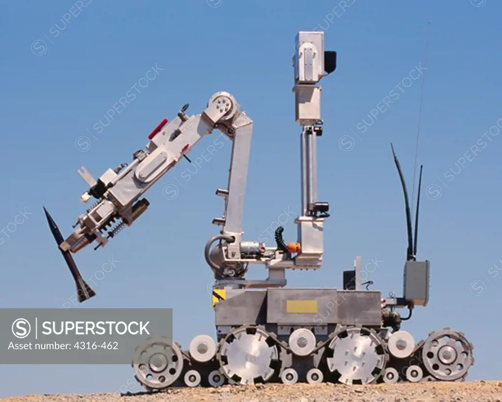 An Explosive Ordnance Disposal Robot Grips a Depleted Uranium Sabot Round