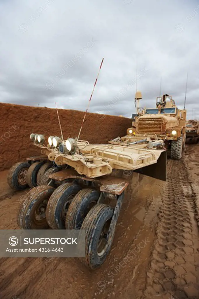 MRAP, or mine resistant ambush protected vehicle, fitted with a mine roller, at a remote, austere United States Marine Corps combat outpost in Afghanistan's Helmand Province