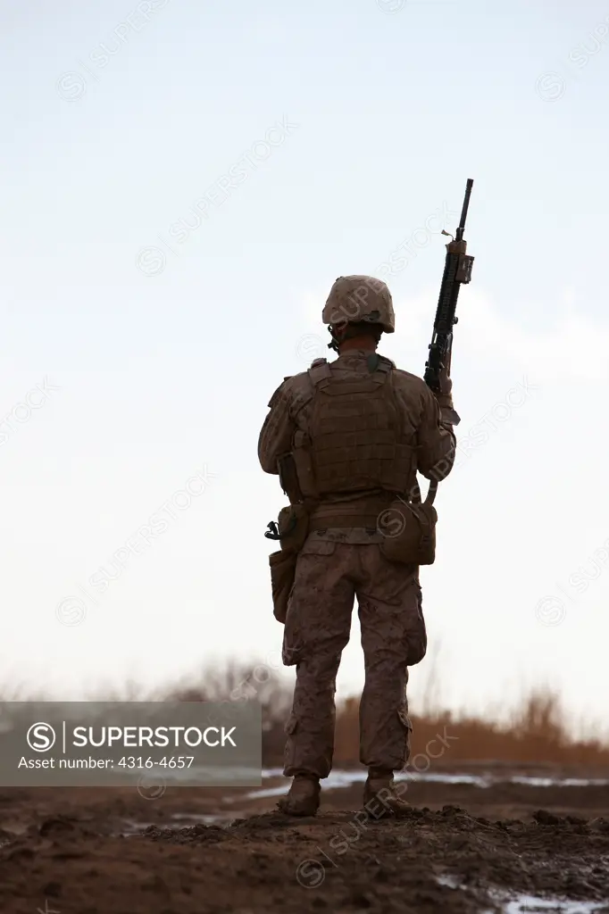 Silhouette of a United States Marine during a combat patrol in Afghanistan's Helmand Province