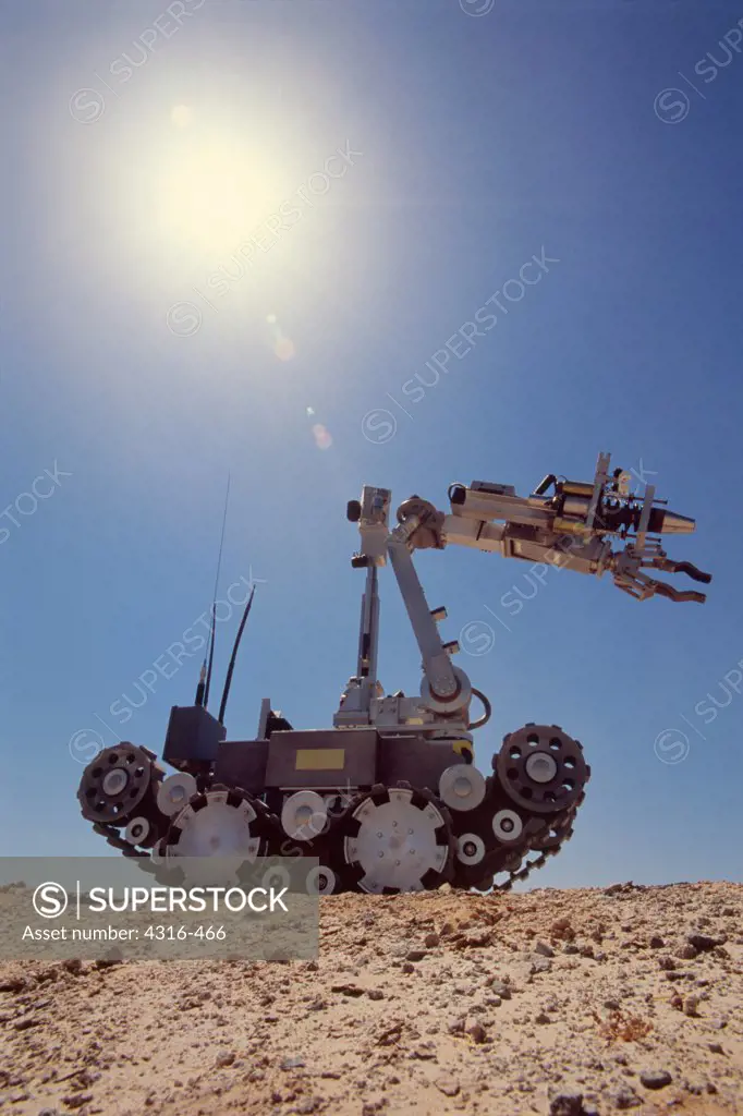 The Harsh Desert Sun Shines on an Explosive Ordnance Disposal Robot