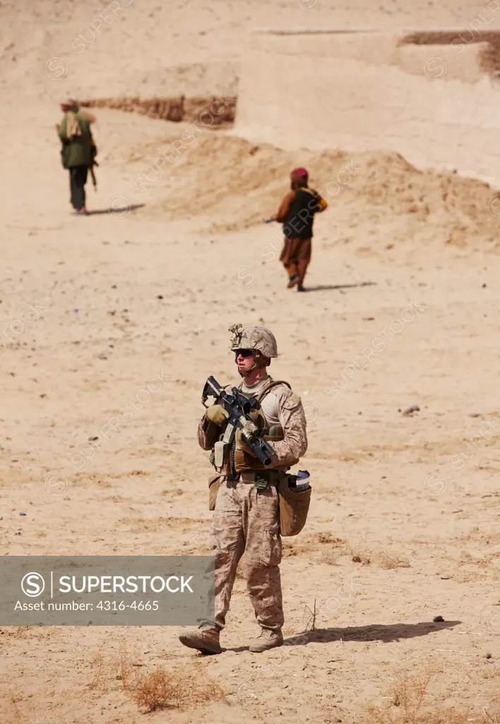 United States Marine on a combat patrol near the city of Marjah, in the Helmand Province of Afghanistan