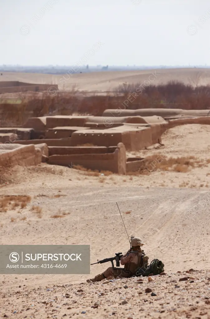 United States Marine with an M16 Rifle during a combat operation in Afghanistan's Helmand Province