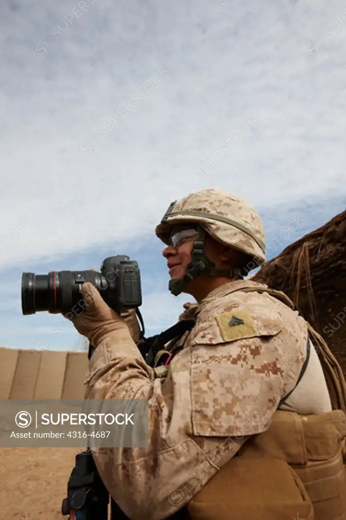 United States Marine Corps combat cameraman during a combat operation in Afghanistan's Helmand Province